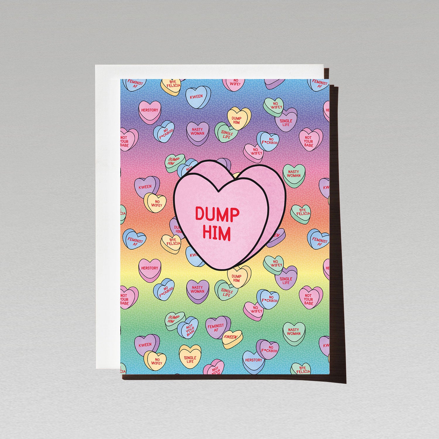 rainbow gradient background love greeting card with lots of candy hearts with female empowerment messages featuring one large pink candy heart with the text dump him